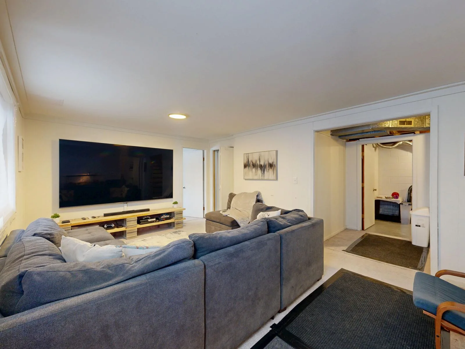 Finished basement living space with clean, modern finishes
