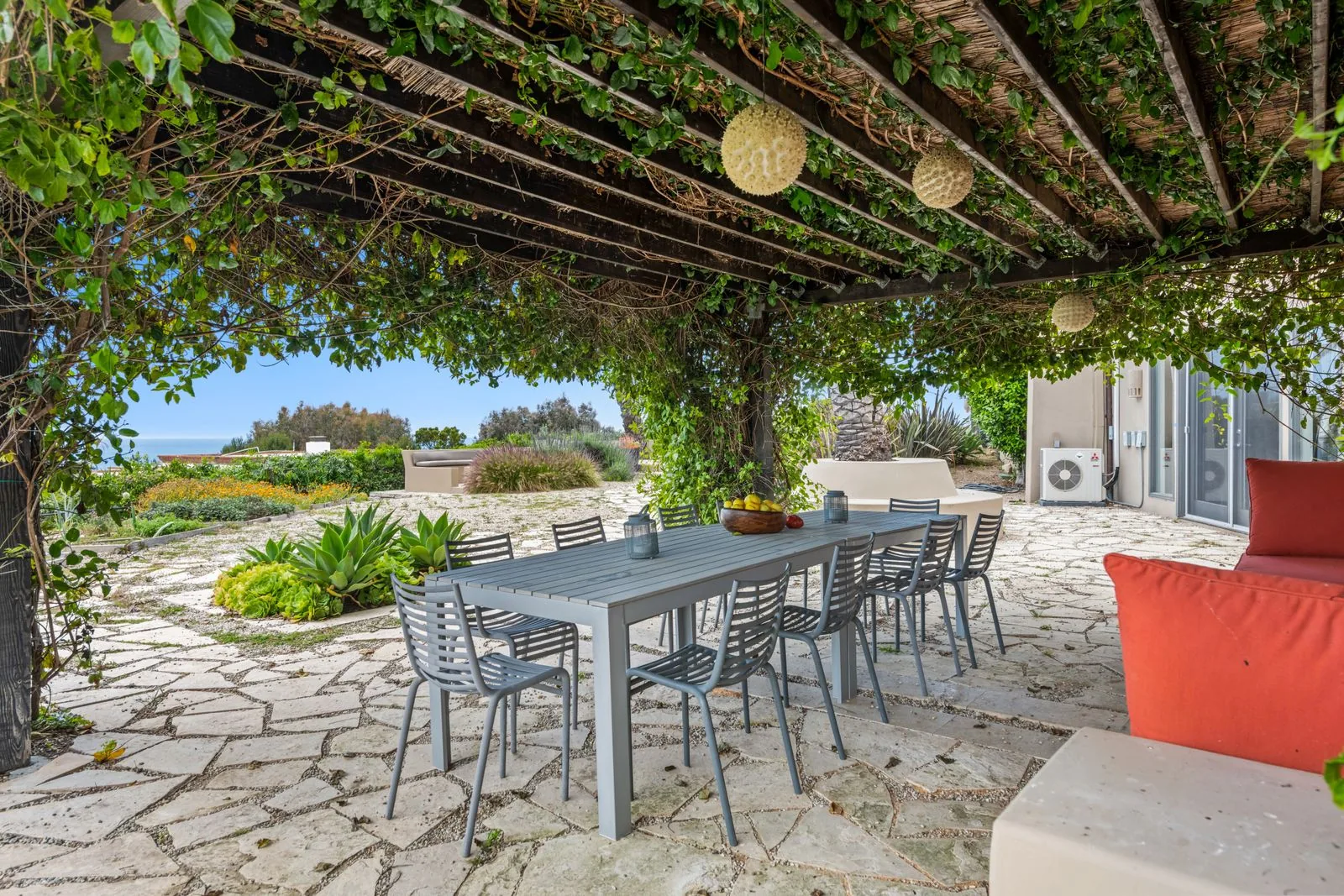 Covered patio outdoor living area with a timeless design