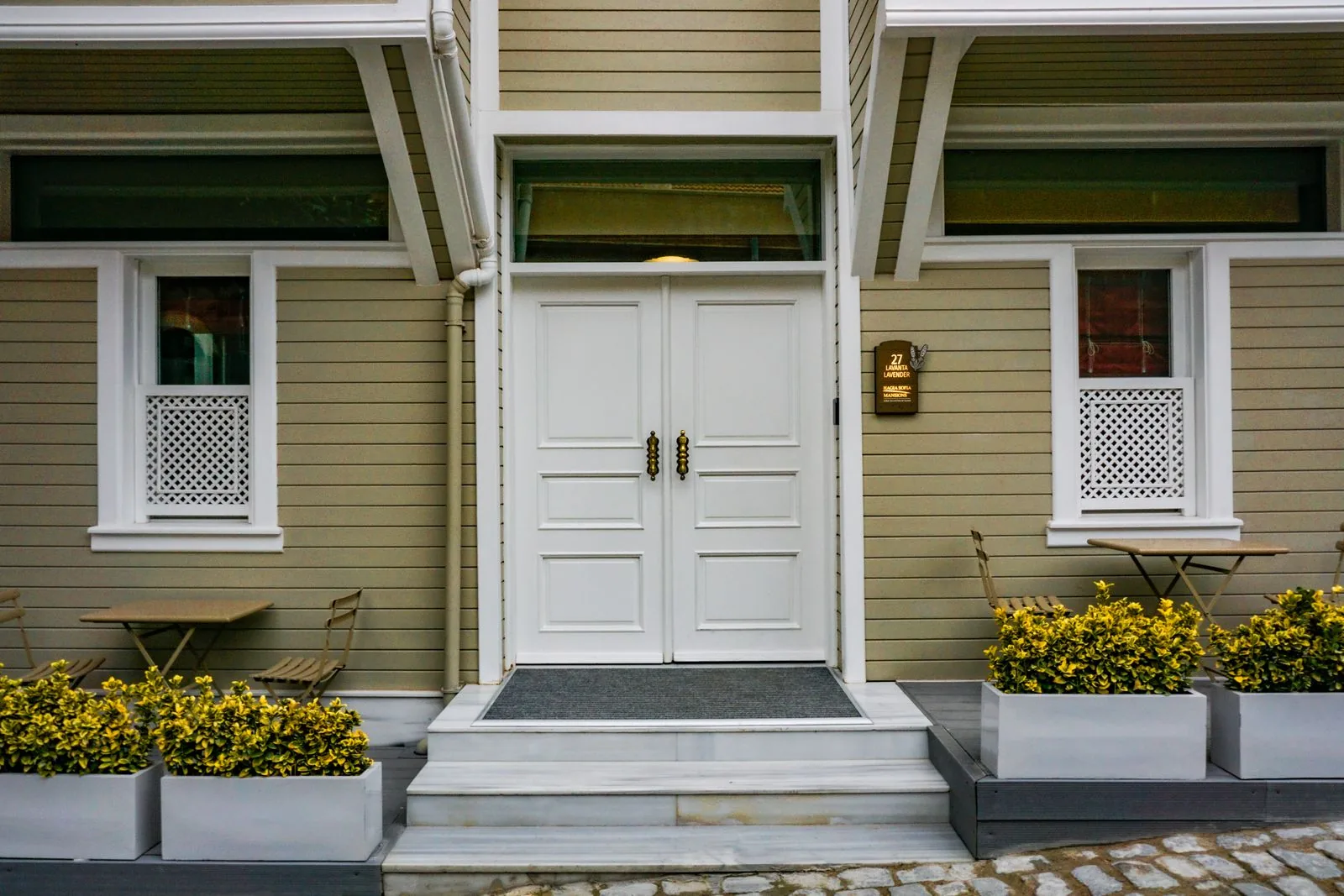 Welcoming front entryway and porch with premium materials