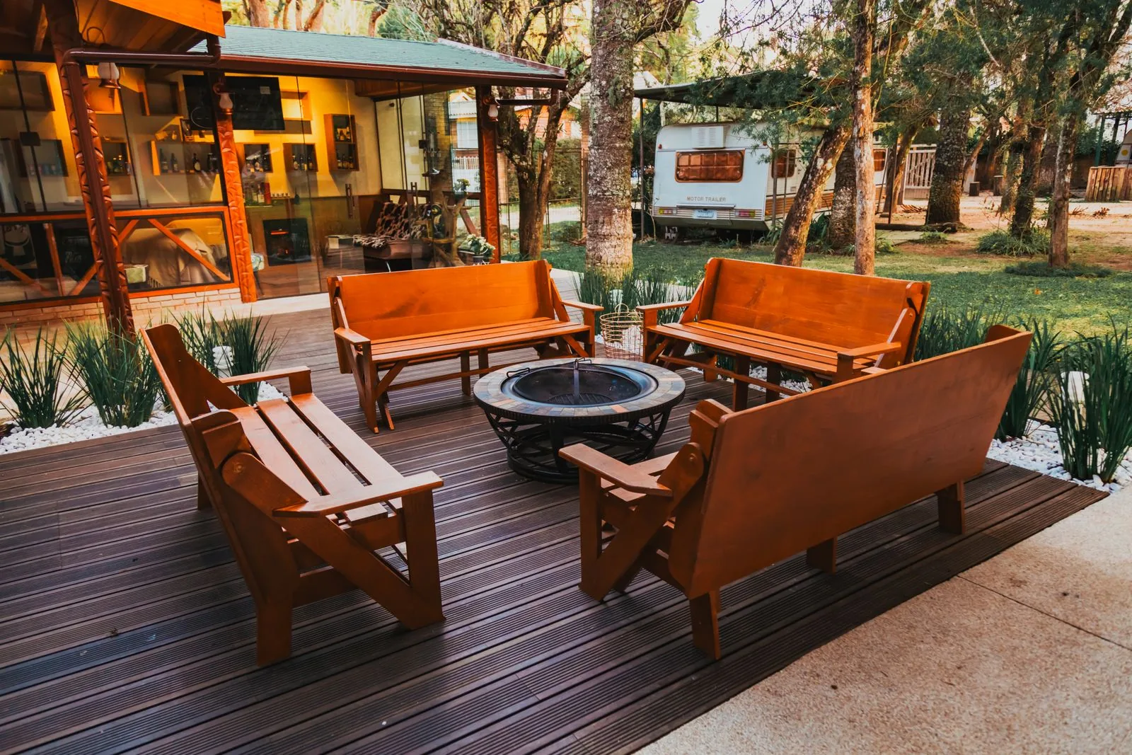 Backyard fire pit seating area after a full remodel