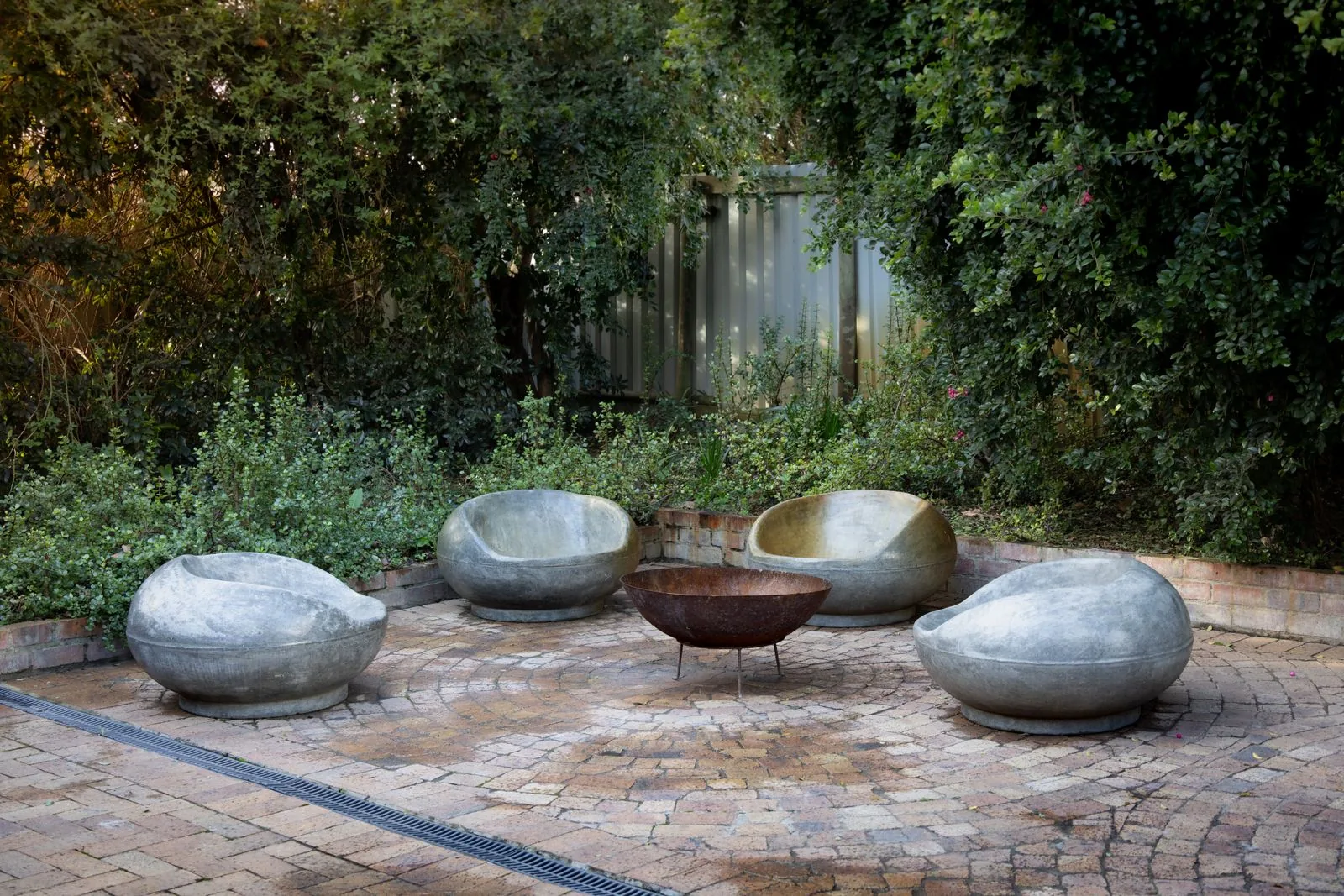 Backyard fire pit seating area with premium materials