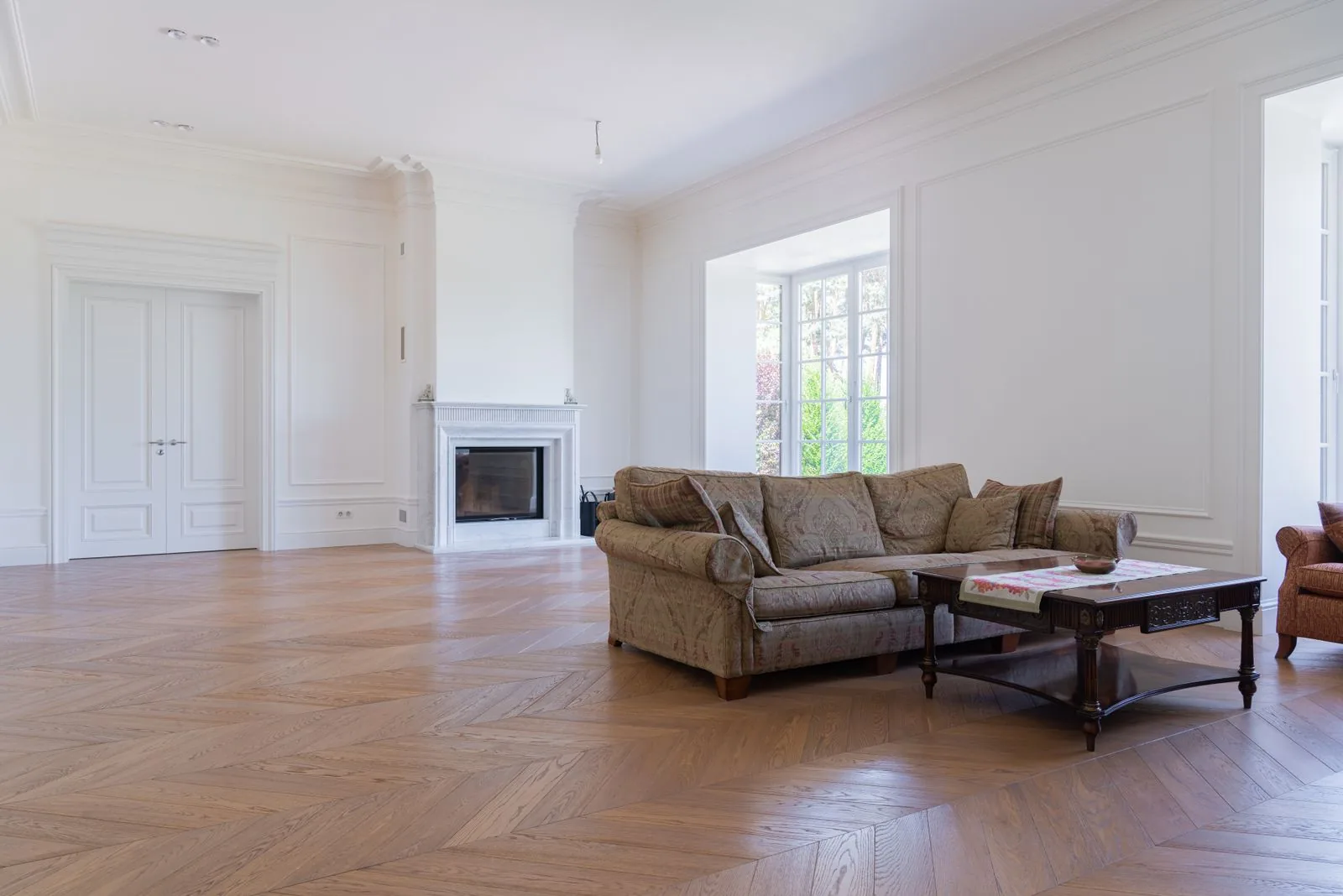 Room with newly installed hardwood flooring with premium materials