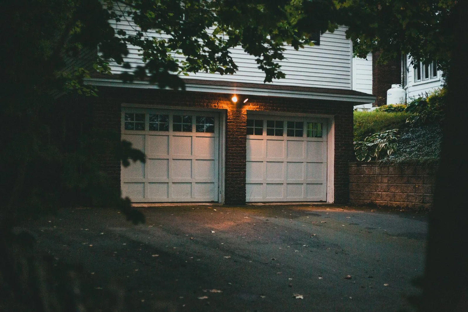 Attached residential garage exterior with natural light