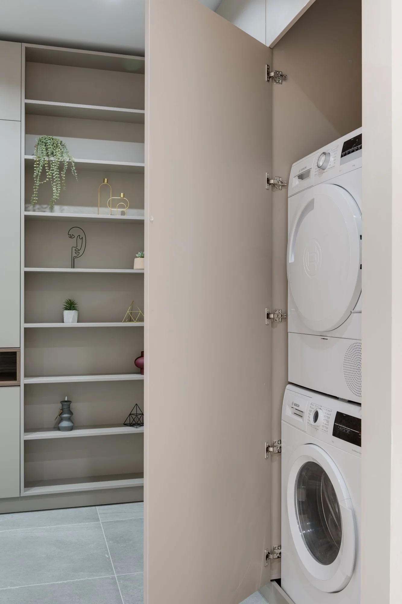 Modern remodeled laundry room with custom cabinetry with a timeless design