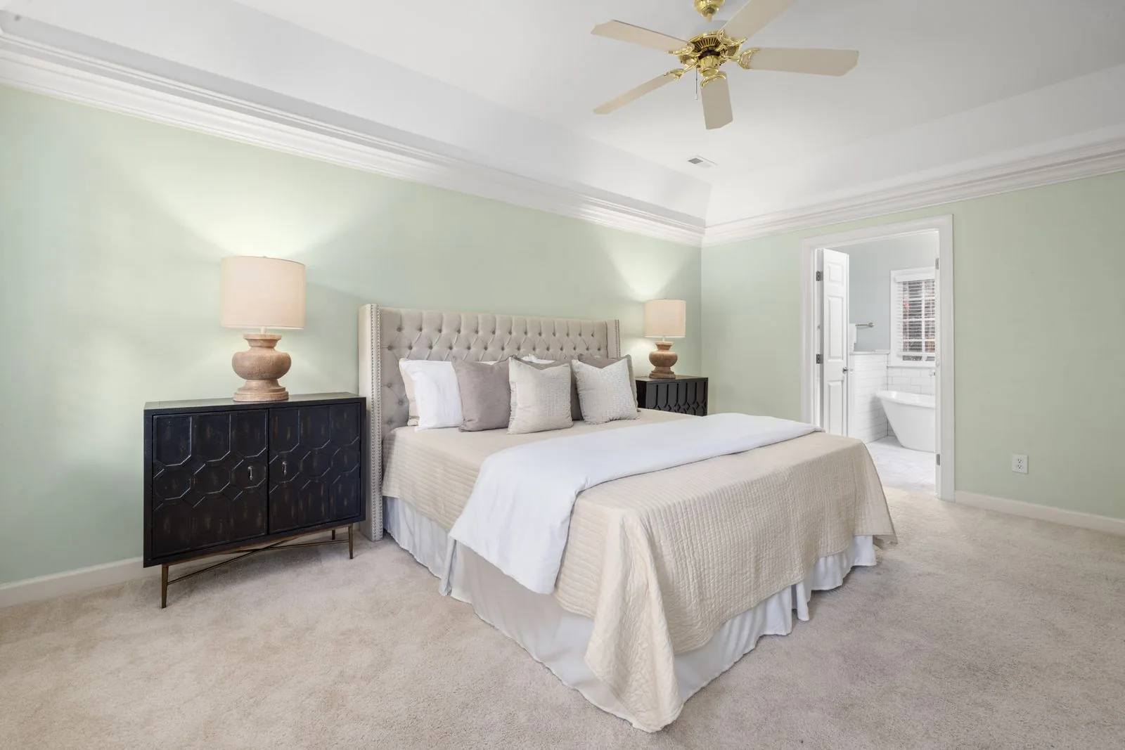 Luxury master suite bedroom with natural light
