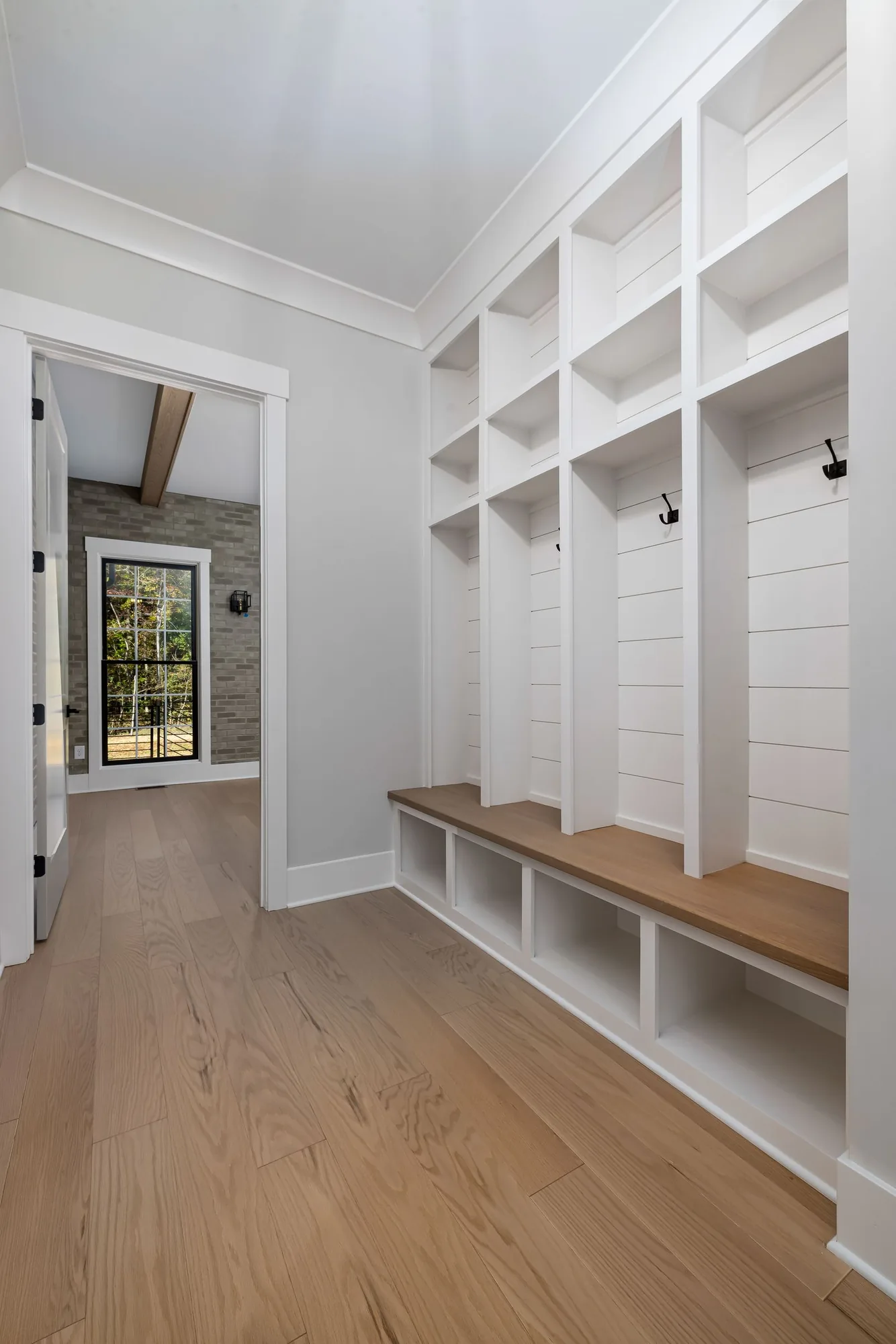 Custom mudroom with a built-in bench and lockers