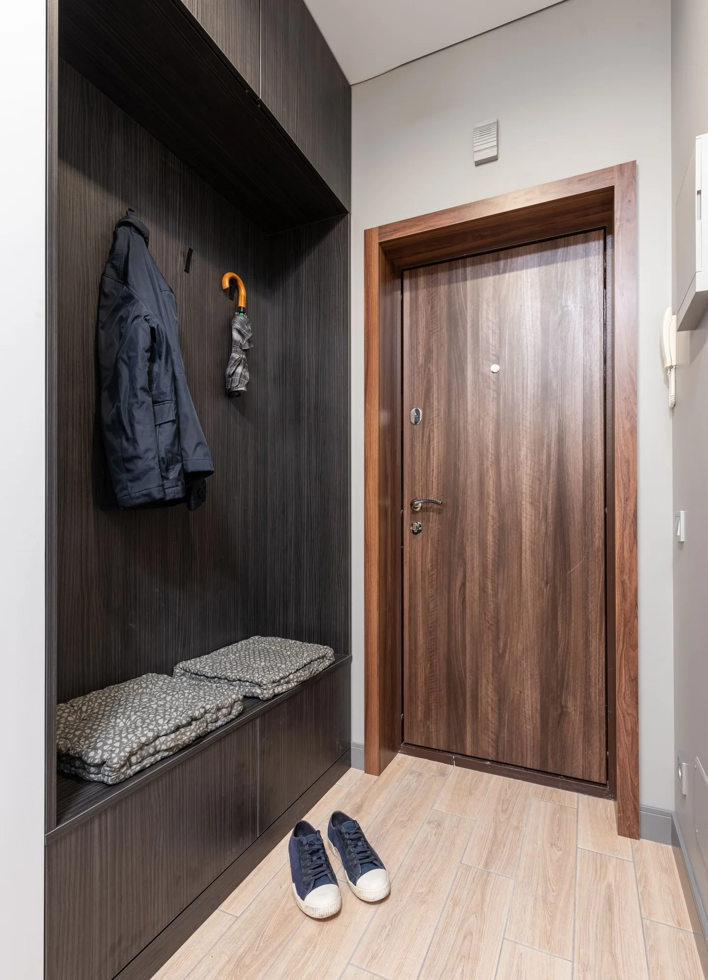 Custom mudroom with a built-in bench and lockers with a timeless design