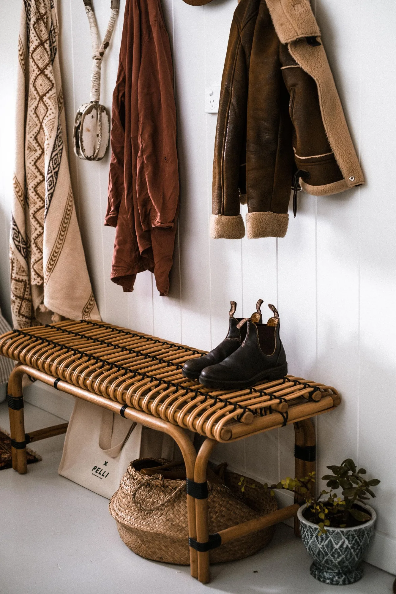 Custom mudroom with a built-in bench and lockers with natural light
