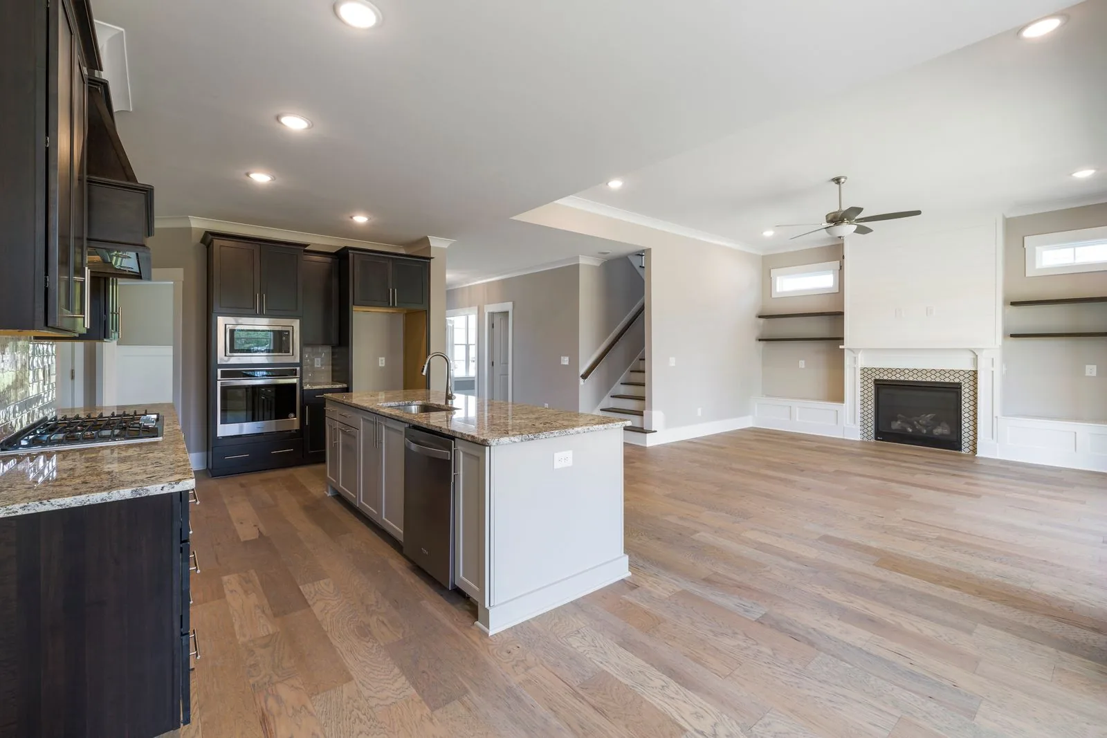 Open-concept living and kitchen space with clean, modern finishes