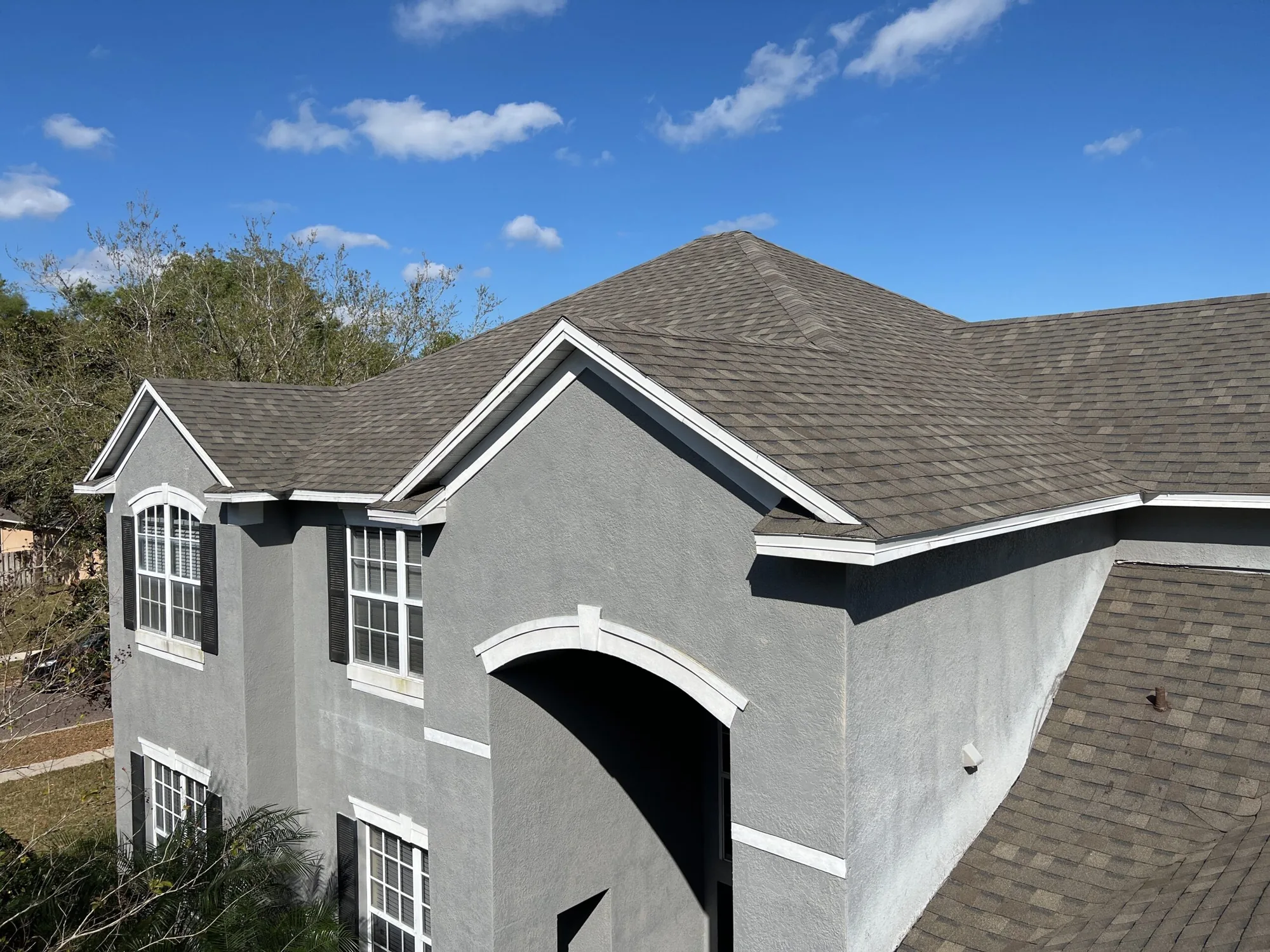 Home exterior with a well-maintained shingle roof