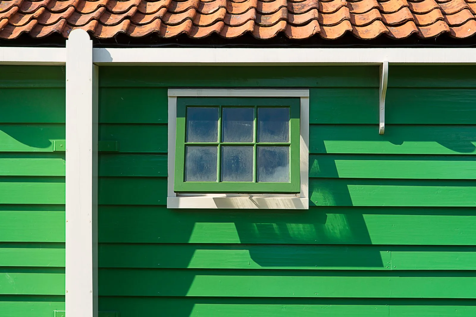 Home exterior with new siding with natural light