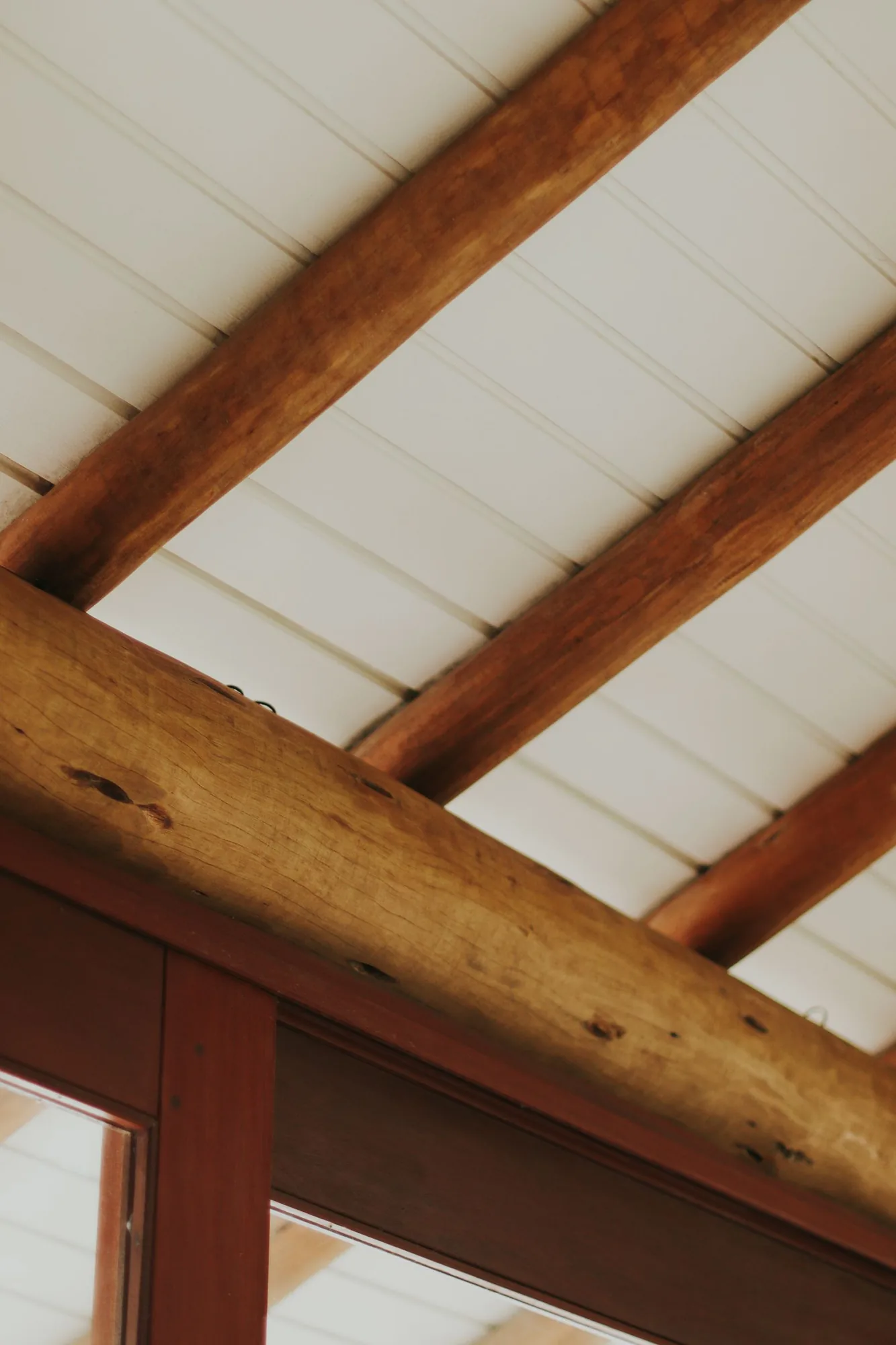 Open interior with exposed structural beams with natural light