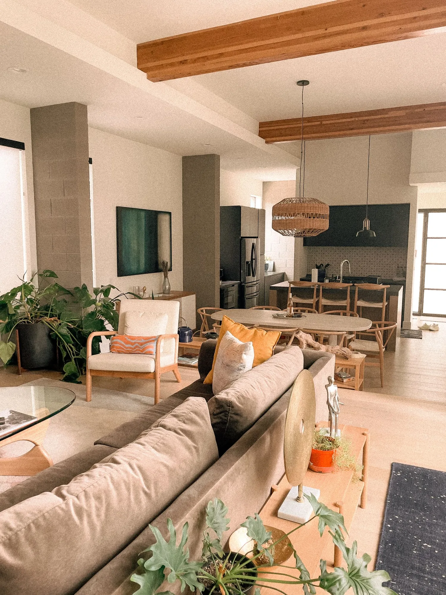 Open interior with exposed structural beams after a full remodel