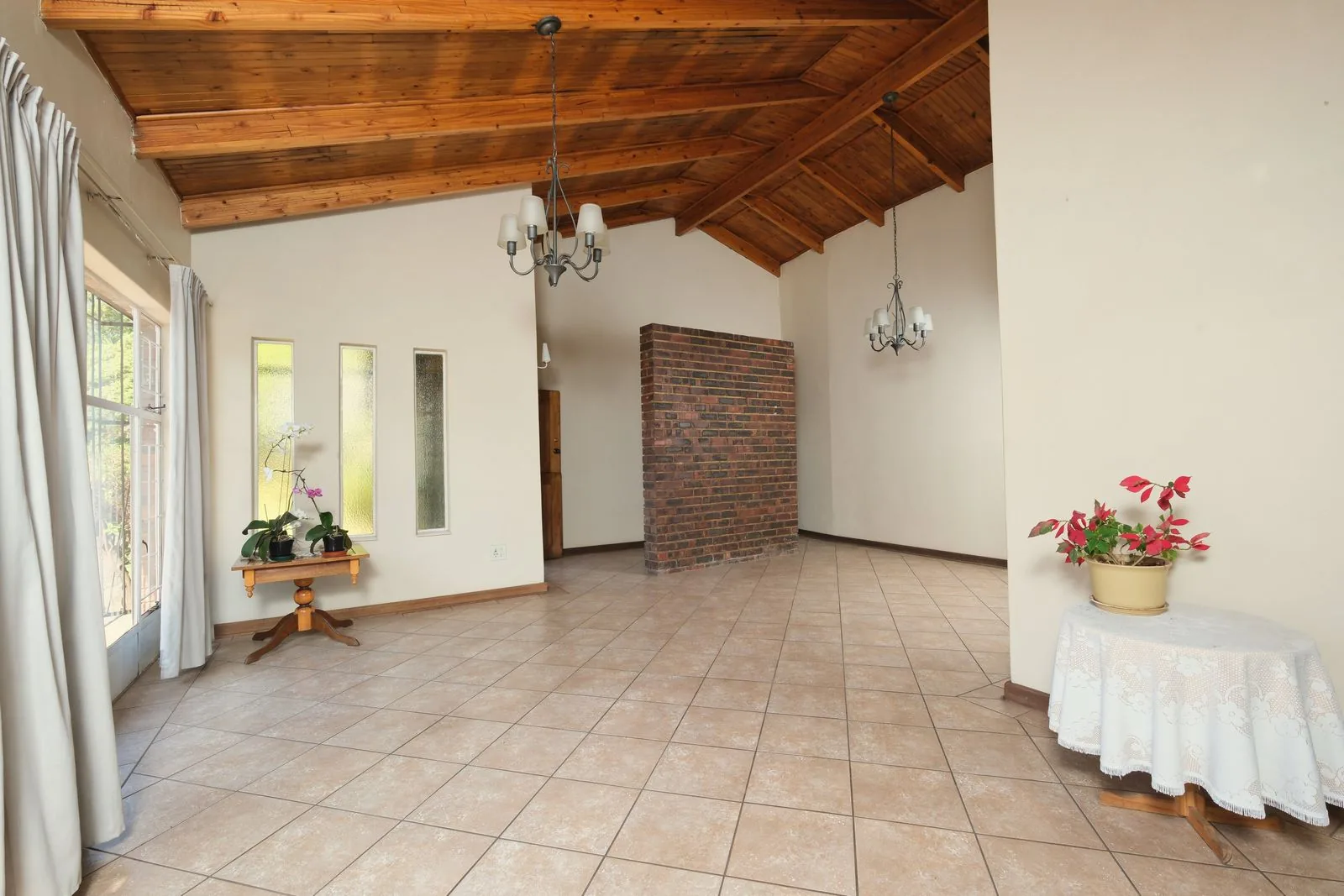 Open interior with exposed structural beams with premium materials