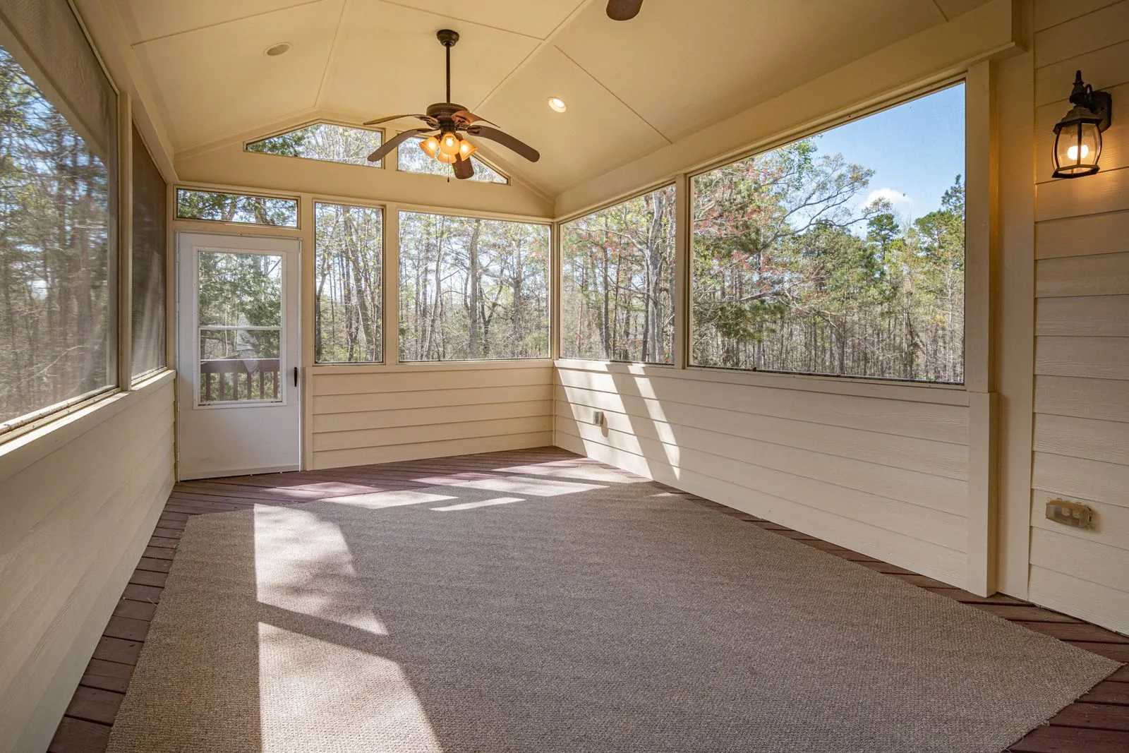 Sunroom addition with walls of glass with a timeless design