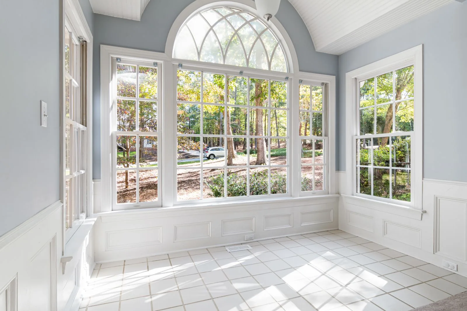 Sunroom addition with walls of glass