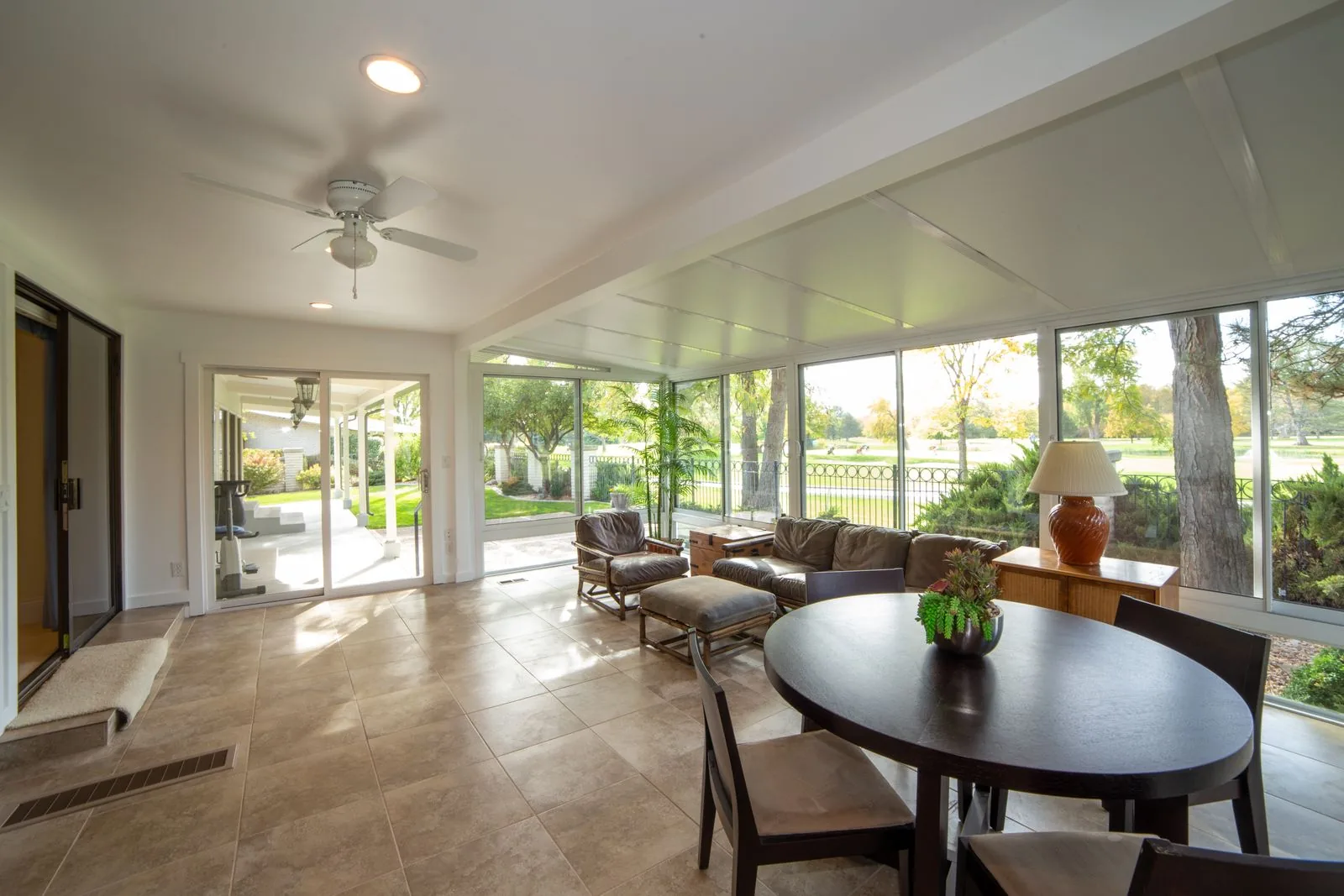 Sunroom addition with walls of glass with premium materials