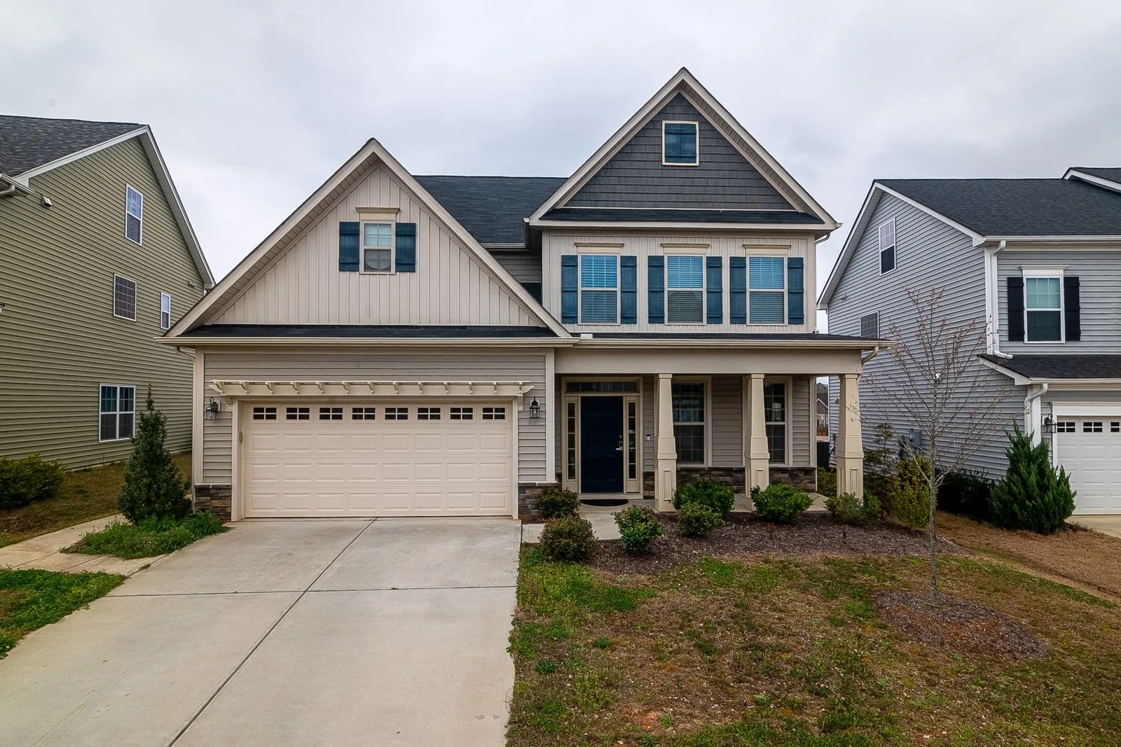 Two-story home exterior with clean, modern finishes