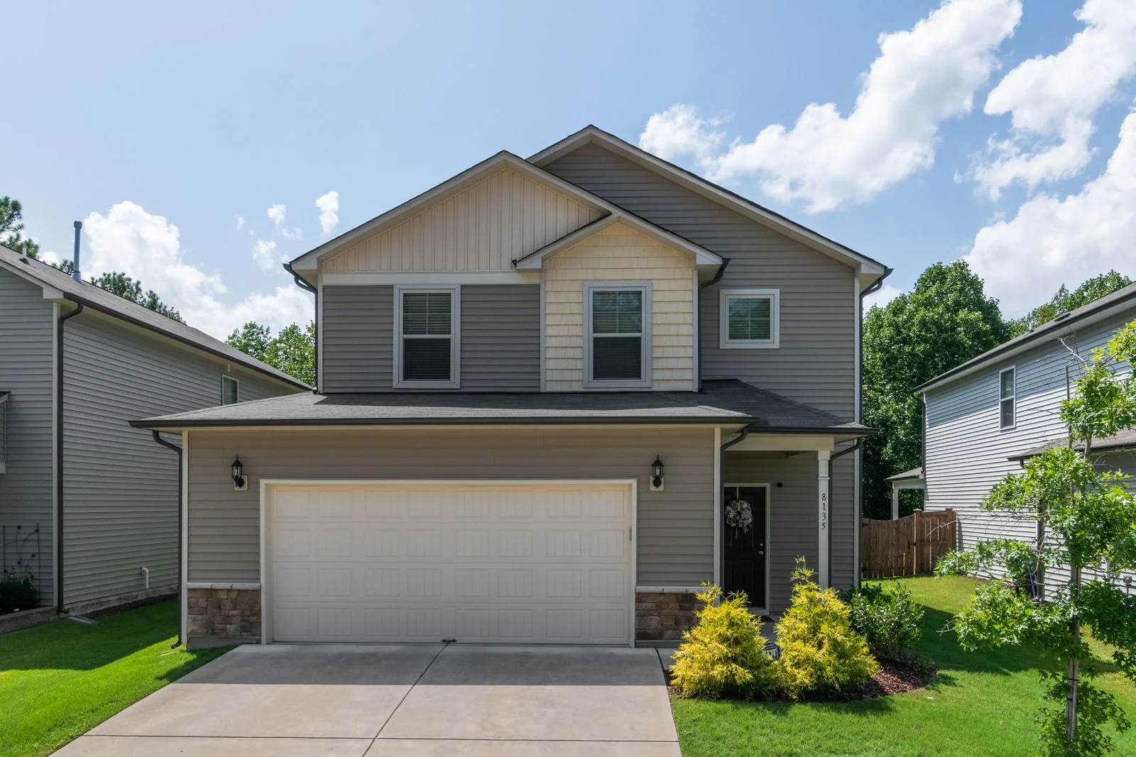 Two-story home exterior with premium materials