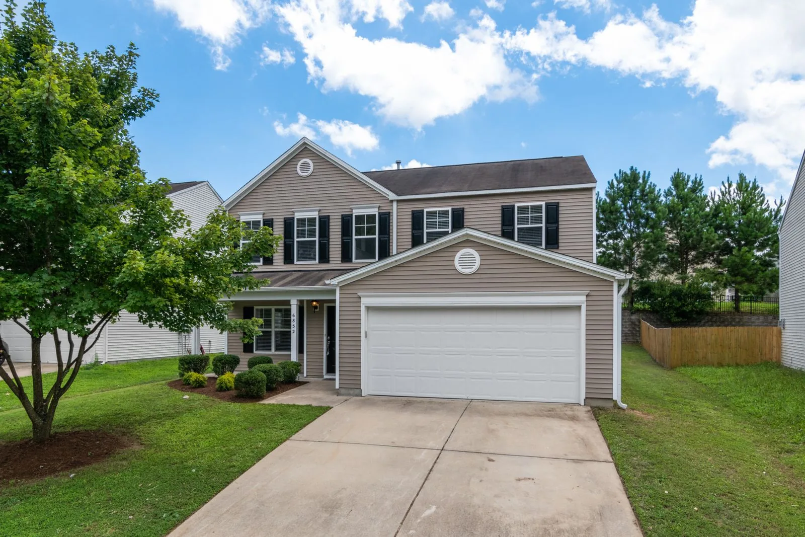 Two-story home exterior with clean, modern finishes