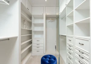 Custom walk-in closet with built-in storage with natural light