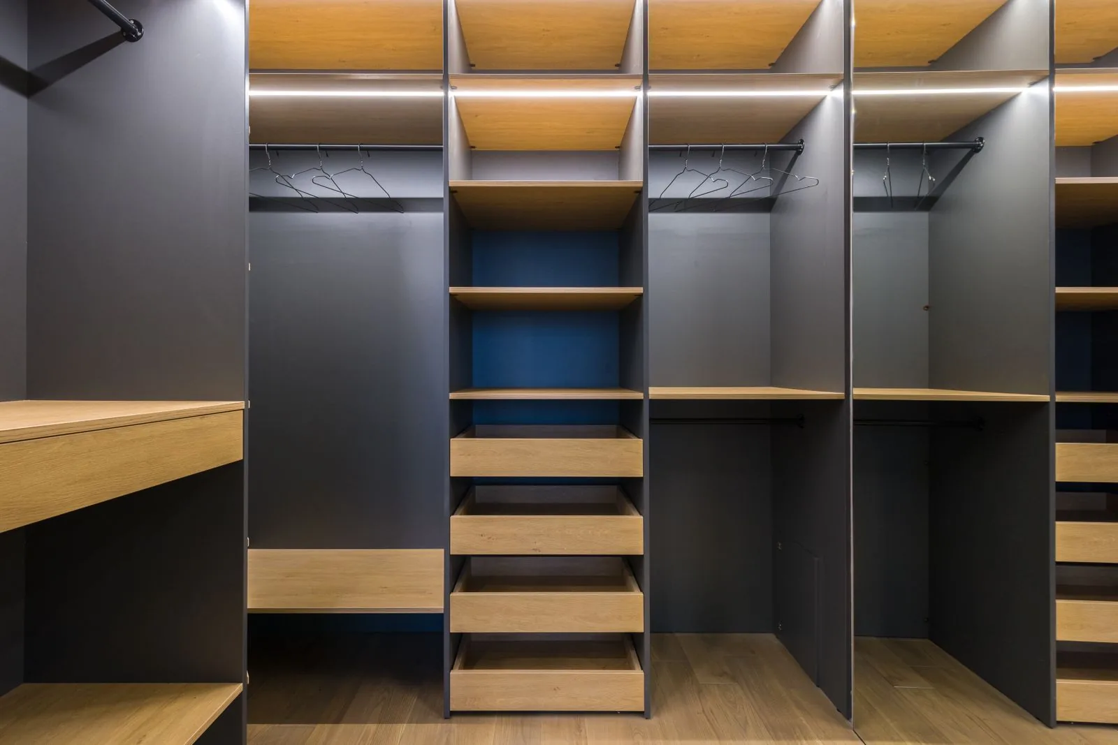Custom walk-in closet with built-in storage by a Bellevue-area remodeler